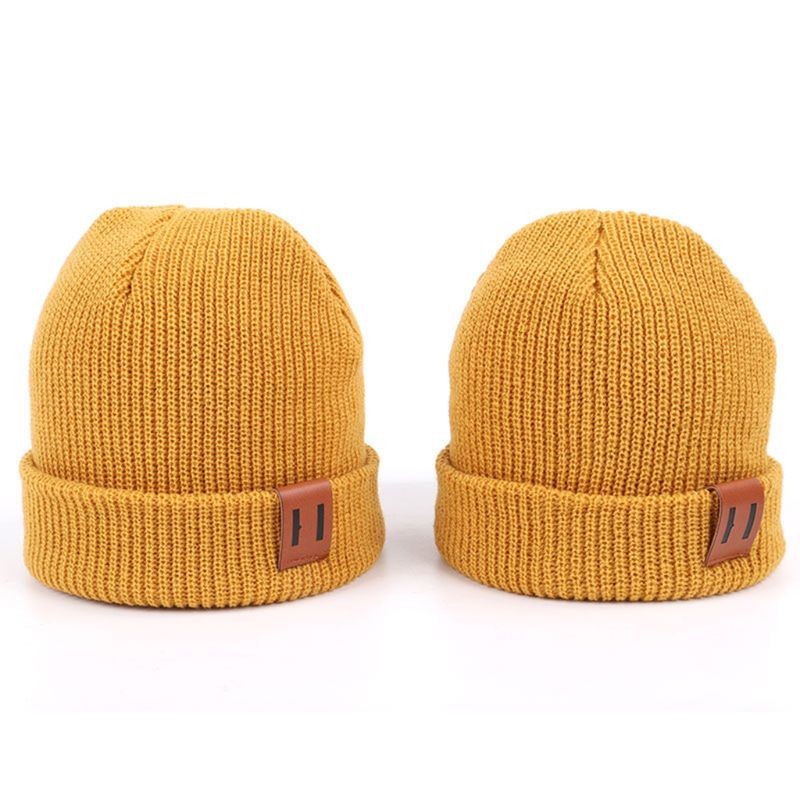 China Leather Patch Knit Beanie Hats Custom Design Warm Hat Cap Yellow Beanie Hats wholesale