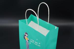 China Custom Kraft Paper Packaging Bag Personalized Printed Paper Bags With Handles wholesale