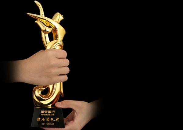 Quality Poly Resin Material Award Cups Trophies With Abstract Figure Design for sale