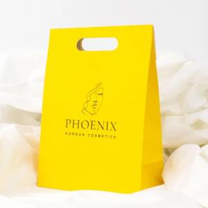 China Clothing Packaging Die Cut Handle Shopping Kraft Paper Bag Customized Yellow Gift Bags wholesale